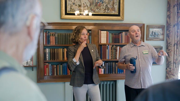 A volunteer guide and a BSL interpreter give a tour of Chartwell, Kent.